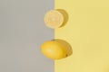 Creative layout made of lemons on grey and yellow background. Selective focus. Minimal style. Top view. Flat lay Royalty Free Stock Photo