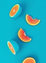 Creative layout made of orange and grapefruit slices on blue background. Flat lay, top view minimal summer concept. Royalty Free Stock Photo