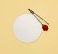 Creative layout made with school geometric compass for drawing circle and red rose. Copy space. Royalty Free Stock Photo