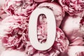 Creative layout. Pink peony flowers and number zero 0. Birthday greeting card. Anniversary concept. Top view. Copy space. Stylish