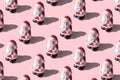 Creative layout of small Santa Clauses on bright background. Minimal Christmas or New Year concept