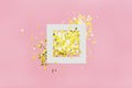 Creative layout with white frame and little silver and golden stars. Royalty Free Stock Photo
