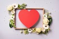 Creative layout with white roses, lily, gerbera, red paper heart over grey background. Top view, flat lay. Spring, summer or Royalty Free Stock Photo