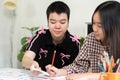 Creative Learning and Collaboration. Two students working together on a project at a table. Royalty Free Stock Photo