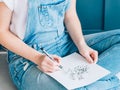 Creative leisure female artist sketching plants