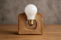 Creative light bulb in bread slice serving as unique lamp design Royalty Free Stock Photo