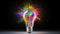 Creative light bulb explodes with colorful paint and splashes Royalty Free Stock Photo