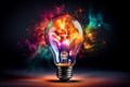 Creative light bulb explosion with splashes of yellow, blue and pink paint on a black background. Think differently, creative idea Royalty Free Stock Photo