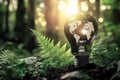 Light bulb with a world map symbolizing sustainability and eco-friendliness Royalty Free Stock Photo