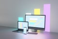 Creative light neon designer desktop with glowing laptop computer monitors, smartphone screen and business charts, graphs and Royalty Free Stock Photo
