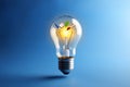 A creative lightbulb filled with elements symbolizing ideas, inspiration, and knowledge Royalty Free Stock Photo