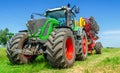 Creative look of a colored tractor seeder. Summer photo for advertisement of agricultural works Royalty Free Stock Photo
