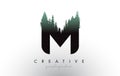Creative M Letter Logo Idea With Pine Forest Trees. Letter M Design With Pine Tree on Top Royalty Free Stock Photo