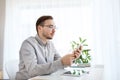 Creative male office worker texting on smarphone Royalty Free Stock Photo