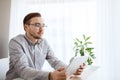 Creative male worker with tablet pc at home office Royalty Free Stock Photo