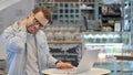 Creative Man having Neck Pain while Working on Laptop Royalty Free Stock Photo