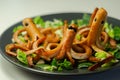 Creative meal for a child, fried sausages in an octopus shape served with fresh gem lettuce