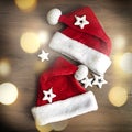 Creative minimal concept of Christmas and New Year. Two blurred santa claus hats