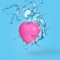 Creative minimal idea made of pink heart and water splash Royalty Free Stock Photo