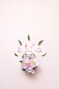 Creative minimalistic composition with a Clock. Alarm clock with peony flowers. Spring time. Time to love. Top view Royalty Free Stock Photo