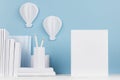 Creative mock up back to school - white stationery, blank blank paper and hot air balloons origami on soft blue backdrop.