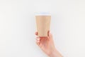 Mock up of coffee cup in female hand