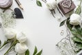 Creative mockup of accessories and flowers on the table.