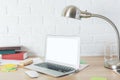 Modern desktop with empty laptop display Royalty Free Stock Photo