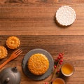 Creative Moon cake Mooncake table design - Chinese traditional pastry with tea cups on wooden background, Mid-Autumn Festival