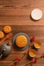 Creative Moon cake Mooncake table design - Chinese traditional pastry with tea cups on wooden background, Mid-Autumn Festival