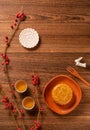 Creative Moon cake Mooncake table design - Chinese traditional pastry with tea cups on wooden background, Mid-Autumn Festival