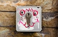 Creative muzzle drawn on keyhole. The castle is painted with street vandalism. Color drawn smiling positive emoticon