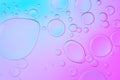 Creative neon background with drops. Glowing abstract backdrop with vibrant gradients on bubbles. Blue and pink
