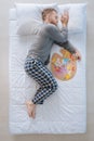 Creative nice man sleeping with an artist palette