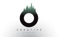 Creative O Letter Logo Idea With Pine Forest Trees. Letter O Design With Pine Tree on Top Royalty Free Stock Photo