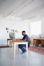 Creative, office or black man typing on laptop working on a blog project, digital or online research. Coworking Royalty Free Stock Photo