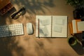 Creative office desk with notebook, empty photos, coffee and office supplies under soft morning sunlight Royalty Free Stock Photo