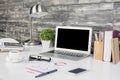 Creative office desktop with blank laptop