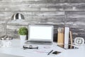 Creative office desktop with blank white laptop Royalty Free Stock Photo