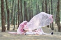 Creative outdoor photoshoot of a malay loving couple bride and groom