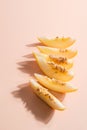 Creative outline with slices of ripe melon on a beige background. Food concept. Fruit isolated on background. Food