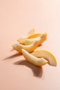 Creative outline with slices of ripe melon on a beige background. Food concept. Fruit isolated on background. Food