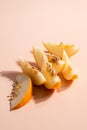 Creative outline with slices of ripe melon on a beige background. Food concept. Fruit isolated on background. Food