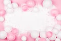 Creative painted background with white pink balloons and confetti. Top view and flat lay. Birthday or party concept
