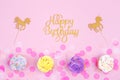 Creative pastel fantasy holiday card with cupcake, happy birthday lettering and unicorn. Baby shower, birthday, celebration