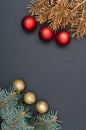 Creative pattern with green and golden Christmas tree branches decorated with baubles. Concept