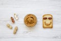 Creative pattern made of toast, peanut butter and peanuts in shells, top view. Royalty Free Stock Photo