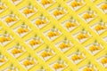 Creative pattern made of macaroon with lemons on white tray and glass of lemonade on sulit background . Summer refreshment Royalty Free Stock Photo