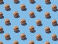 Creative pattern of walnuts on a bright blue background