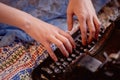 A creative person, author of books, writer of bestsellers,a journalist typing on an old typewriter. Inspiration in the Royalty Free Stock Photo